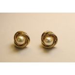 A Pair of Cultured Pearl and 9 ct Yellow Gold Knot Cluster Earstuds Each set to the centre with a
