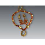 An Ancient Style  22 ct Gold and Carnelian Necklace with carved Agate Cameo, in a 22 ct gold and