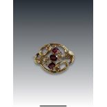 An Antique Almandine Garnet and 15 ct Yellow Gold Brooch, circa 1860 the scrolled oval design brooch