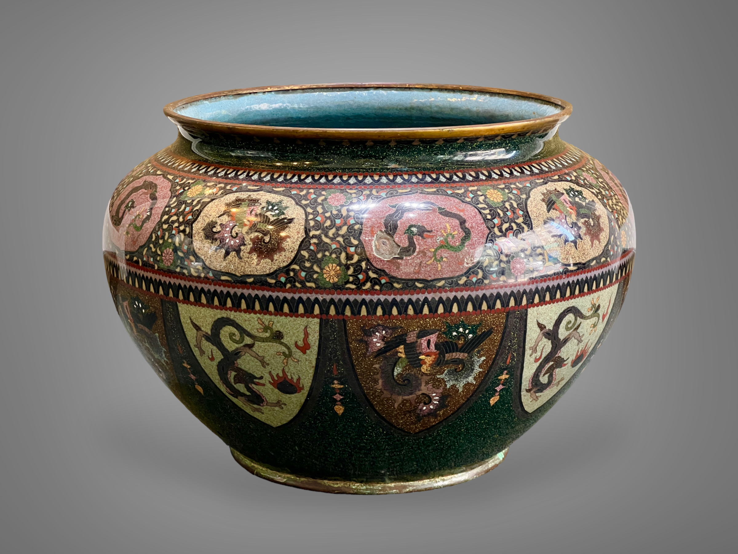 A large Japanese Cloisonne Jardiniere, Meijithe compressed baluster sides with a band of oval