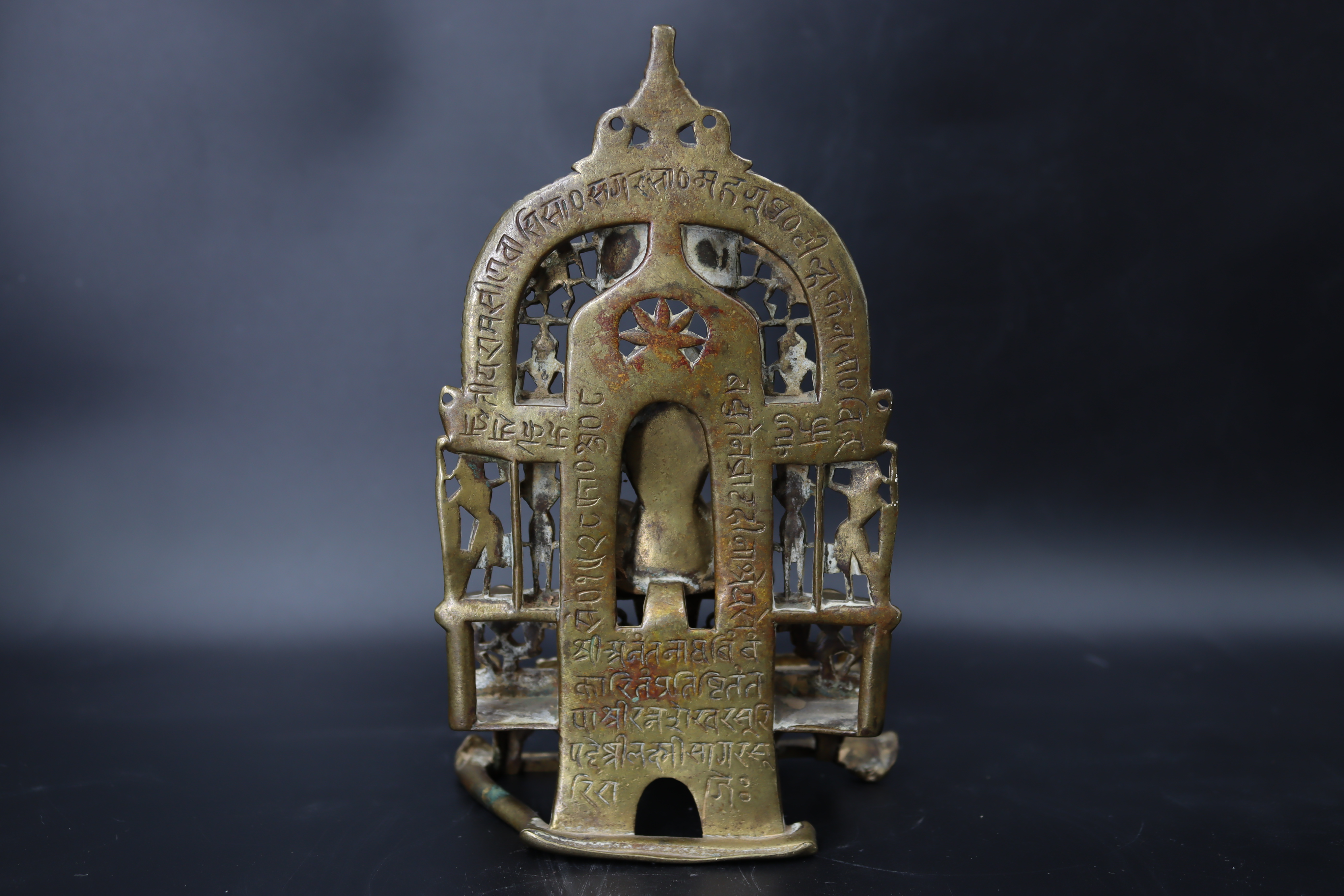 A Bronze Jain shrine. India 15th century.A Jain shrine depicting a Tirthankara with silver inlaid - Image 8 of 18