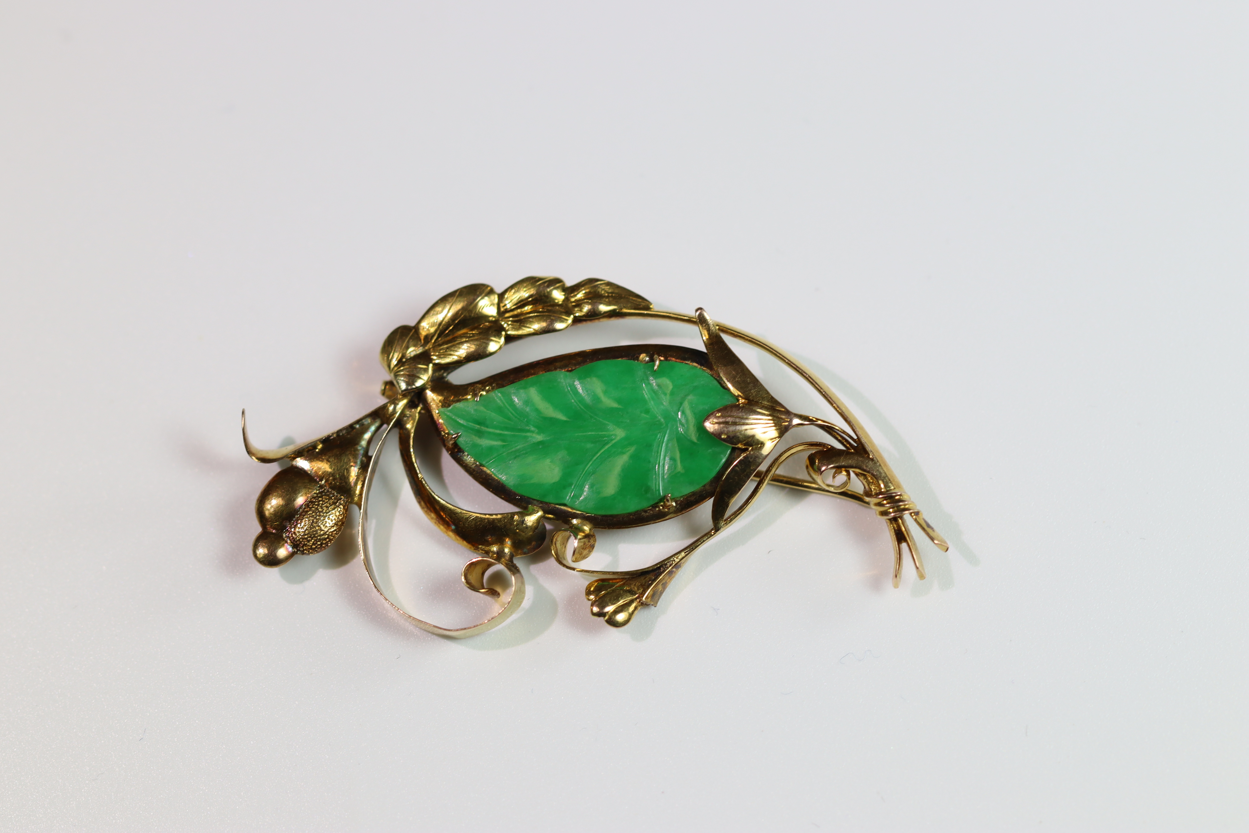 A 1940's Jadeite Brooch the strong apple green coloured jadeite carved as a leaf, with yellow - Image 2 of 7