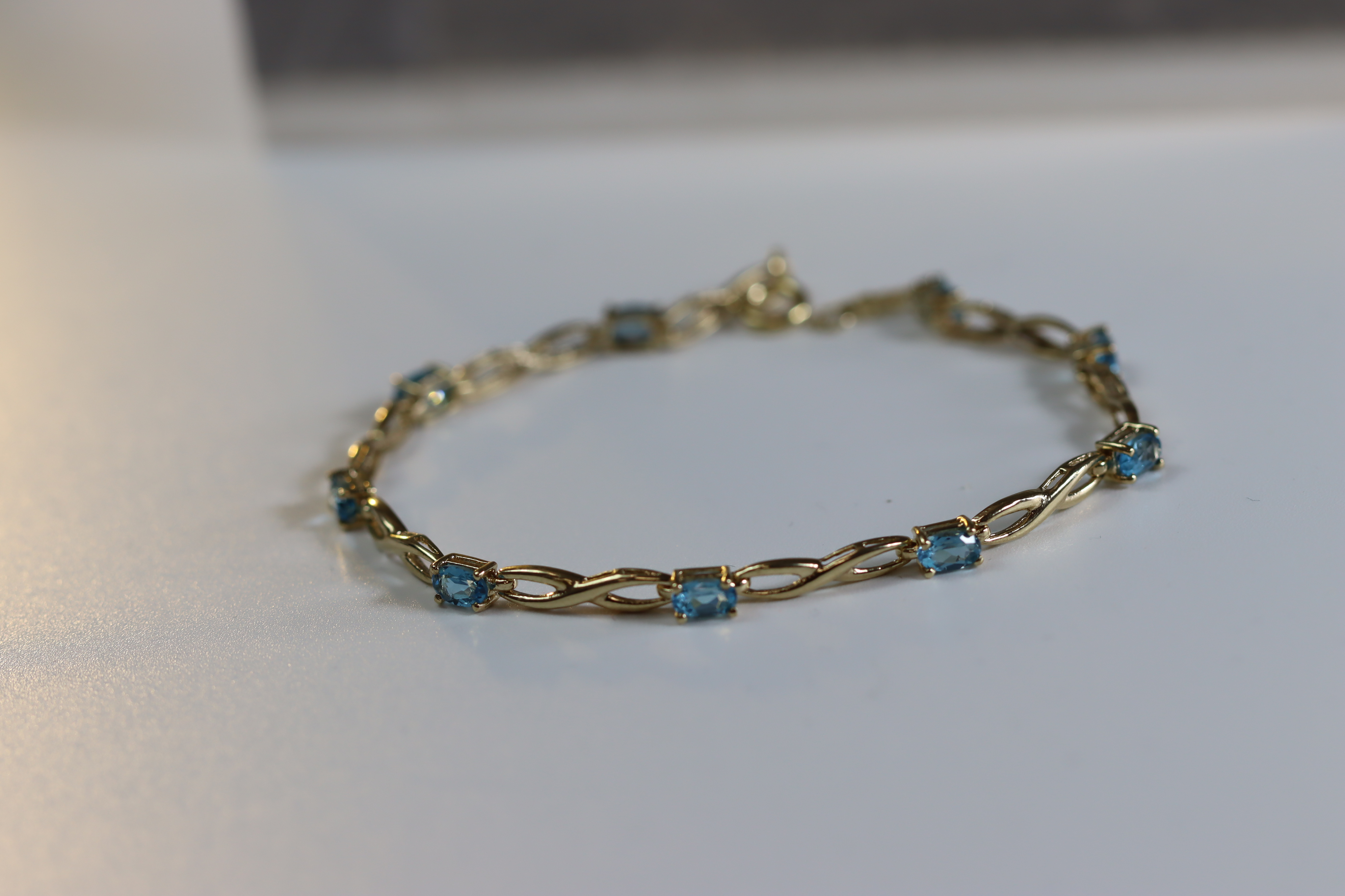 A Blue Topaz and Yellow Metal Line Bracelet A Blue Topaz and Yellow Metal Line Bracelet, set with - Image 2 of 8