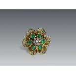 A 1950s Diamond, Cabochon Emerald and Yellow Gold Cluster Clip Brooch, set to the centre with a