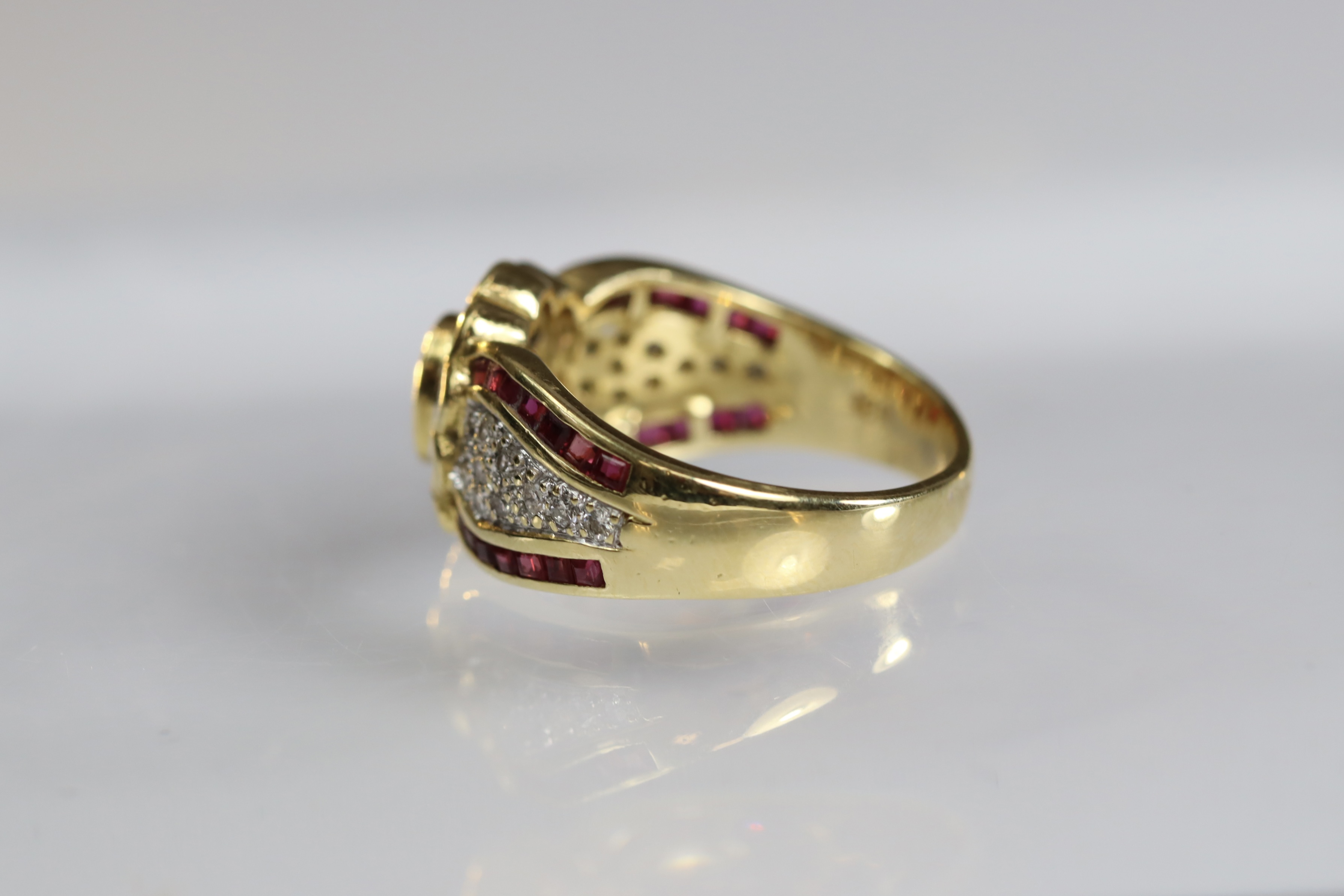 A contemporary 18 carat Yellow Gold, Ruby and Diamond Dress Ring,the oval shaped ruby central - Image 6 of 14