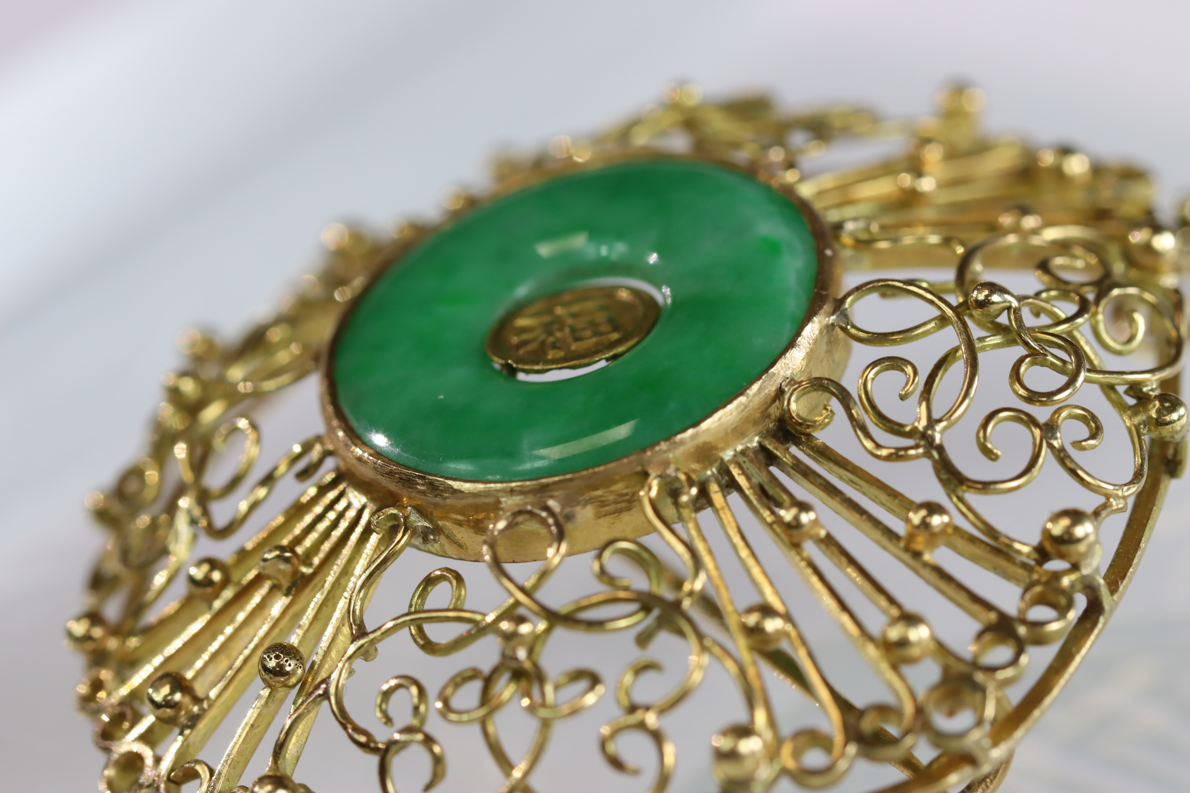 A 1960s Apple Green Jadeite Bi Disc and 18 ct Yellow Gold Pendant/Brooch, in entwined wirework - Image 10 of 14