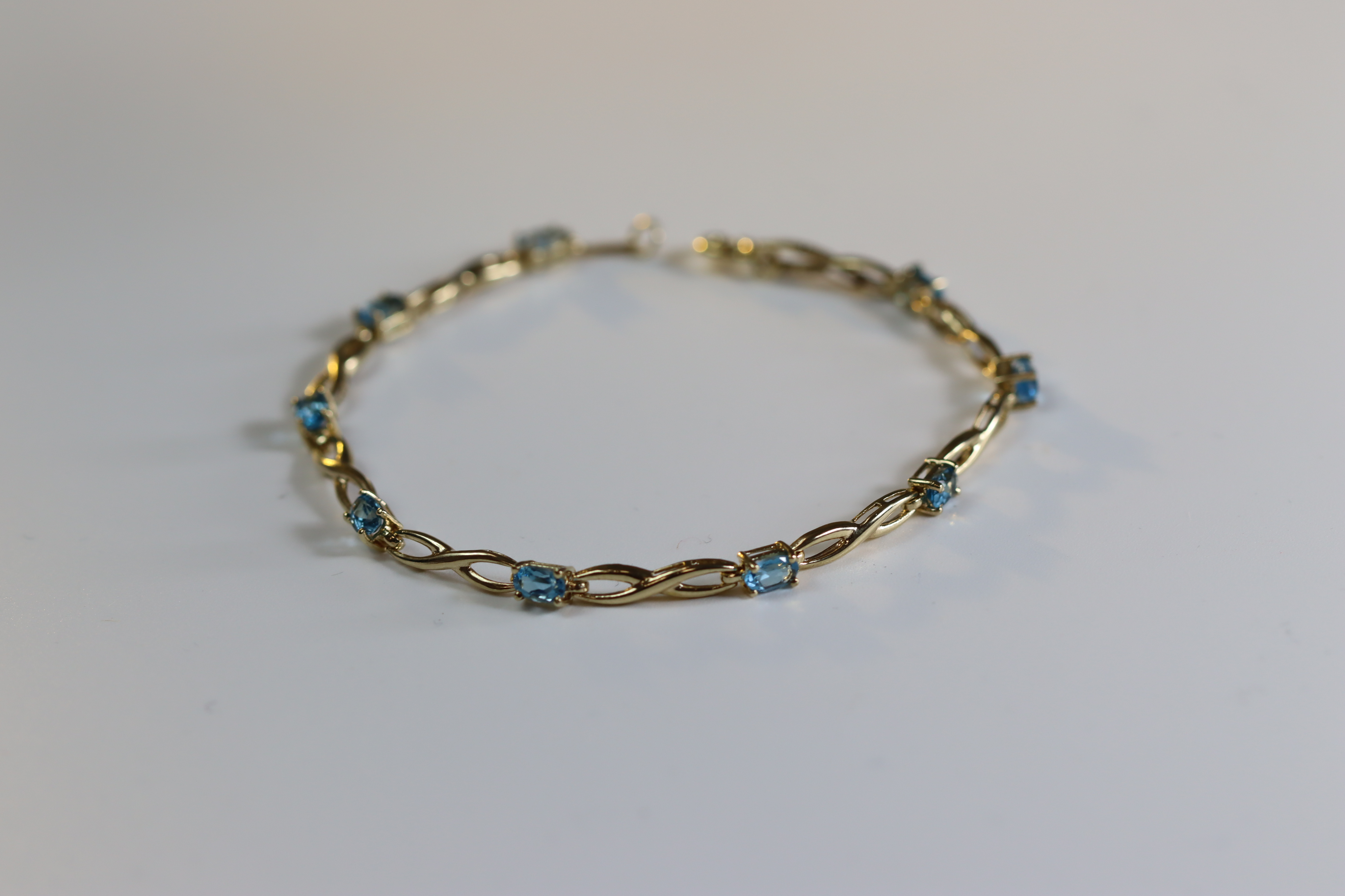 A Blue Topaz and Yellow Metal Line Bracelet A Blue Topaz and Yellow Metal Line Bracelet, set with - Image 3 of 8