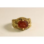 An ancient-style Carnelian Intaglio and Yellow Gold Dress Ring The oval intaglio engraved with a