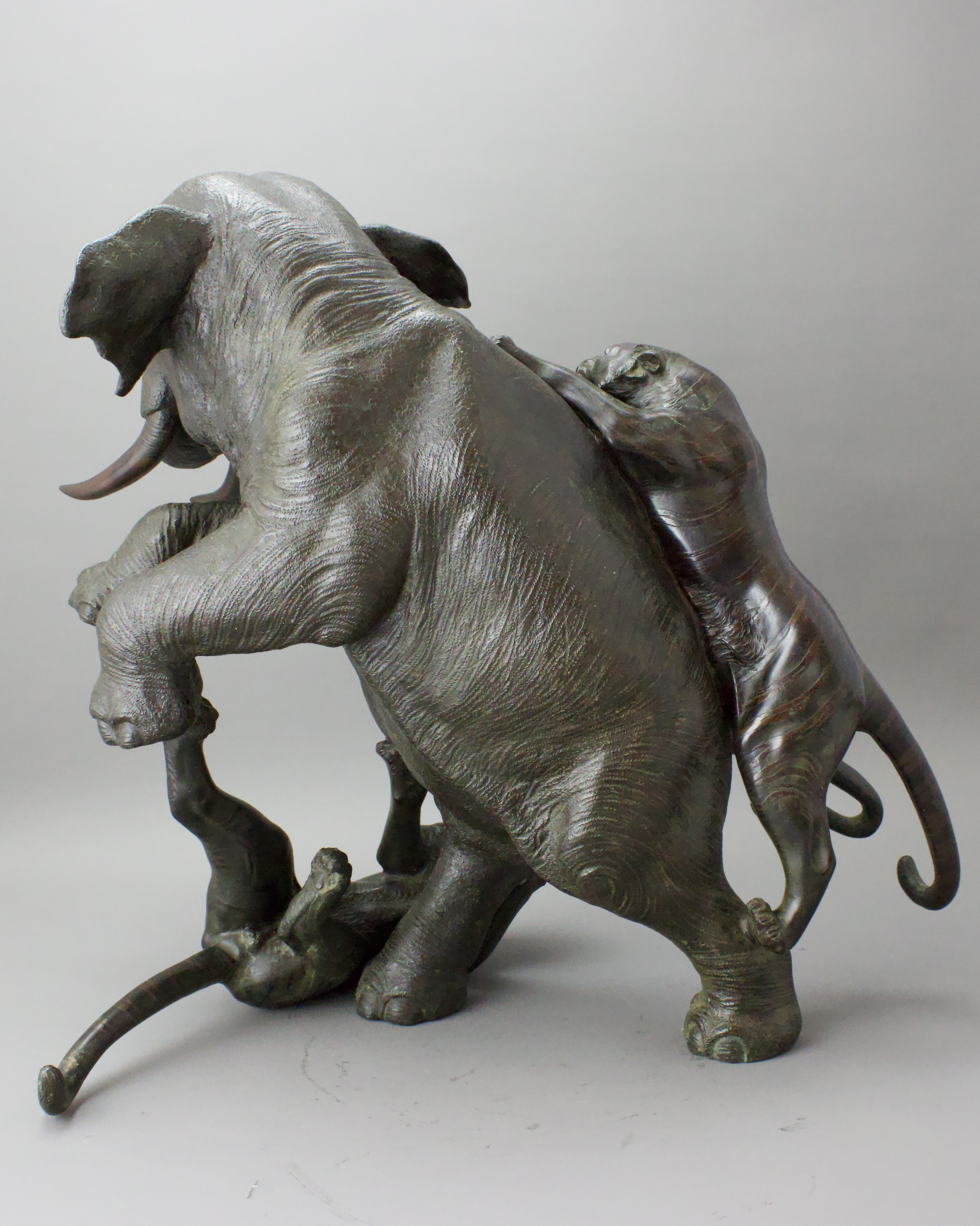 A Japanese Bronze Elephant and Tigers Group, Meiji period,with one seal, the enraged elephant in - Image 7 of 14