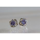 A Pair of Iolite and Diamond Cluster Earrings A Pair of Iolite and Diamond Cluster Earrings, mounted