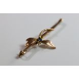 An Antique 9 ct Yellow Gold and Sapphire Dragonfly Bar Brooch An Antique Yellow Gold and Sapphire