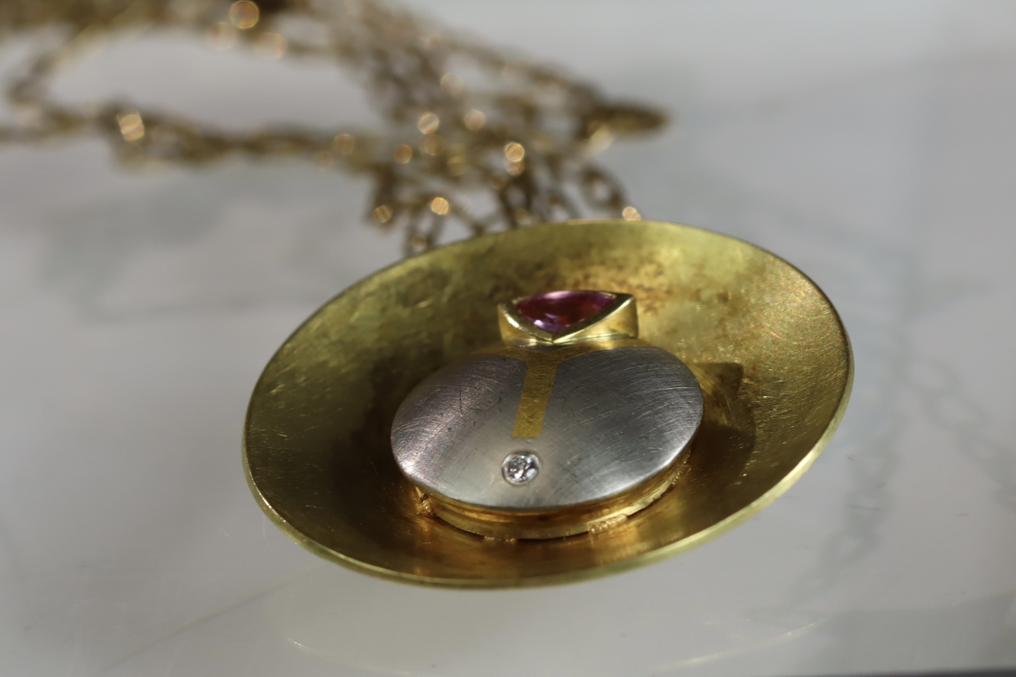 An Unusual Gold, Platinum, Diamond and Ruby Disc Pendant, on a long chain, chain set in 9 ct gold, - Image 7 of 10