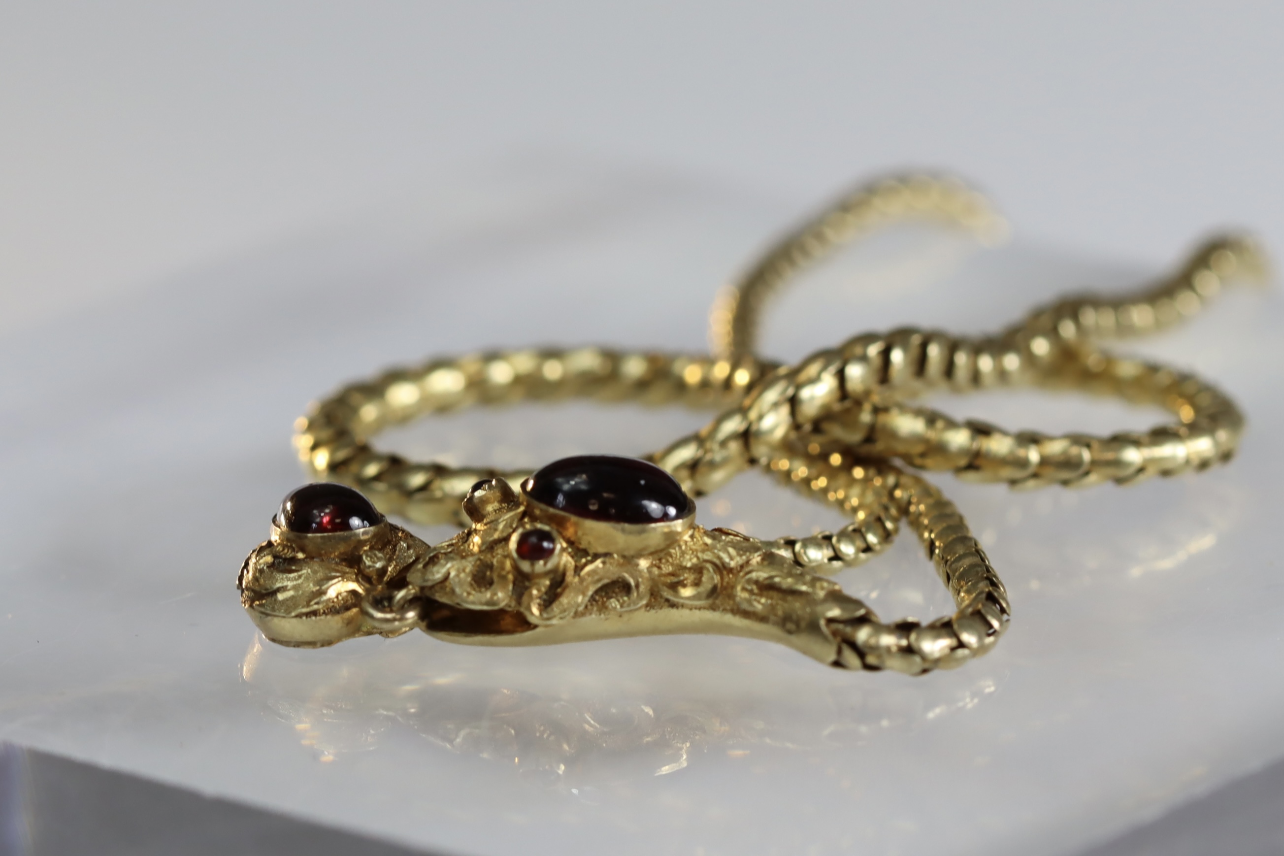 An attractive Antique Cabochon Garnet and Yellow Gold Snake Pendant, circa 1870,the head formed from - Image 3 of 13