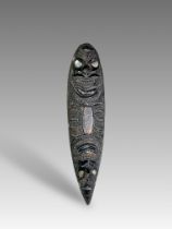 A Maori vessel with mythical figures. New Zealand. A finely carved vessel decorated with heads of