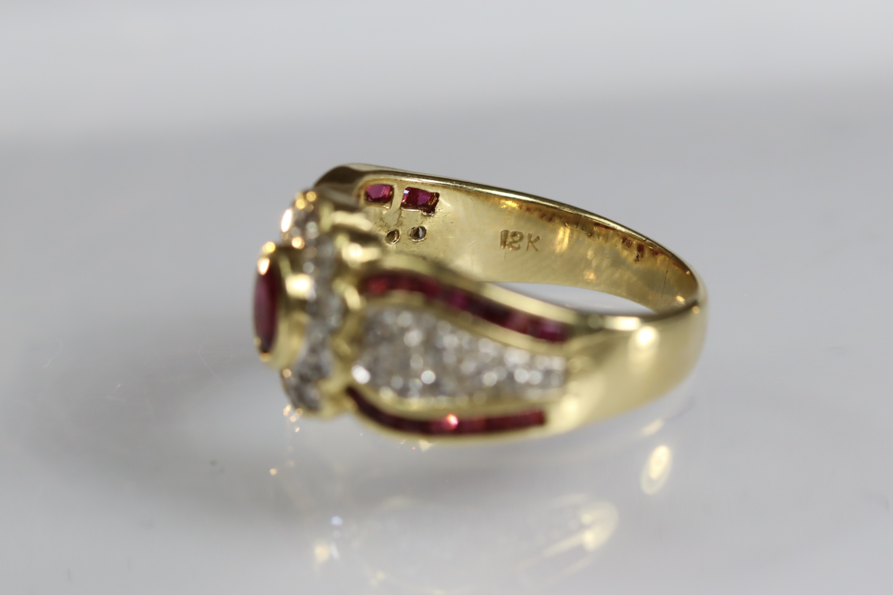 A contemporary 18 carat Yellow Gold, Ruby and Diamond Dress Ring,the oval shaped ruby central - Image 13 of 14