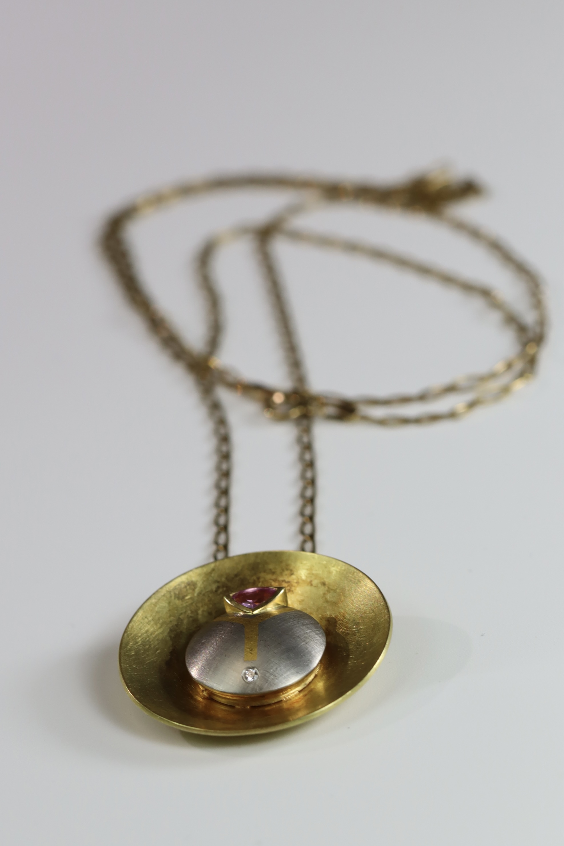 An Unusual Gold, Platinum, Diamond and Ruby Disc Pendant, on a long chain, chain set in 9 ct gold, - Image 2 of 10