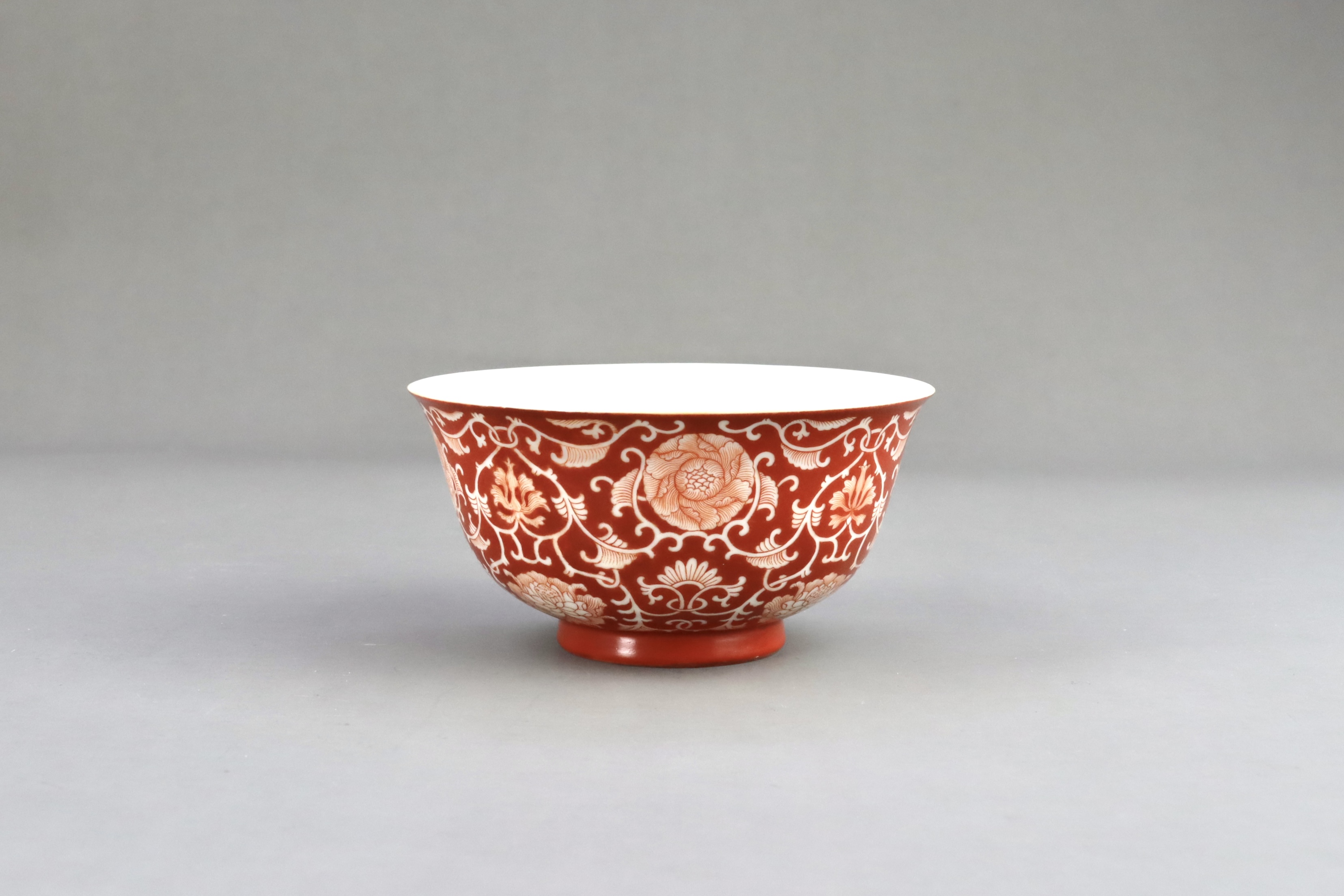 A Coral Ground Bowl with Scrolling Flowers, six character underglaze blue seal mark of Qianlong and  - Image 3 of 6