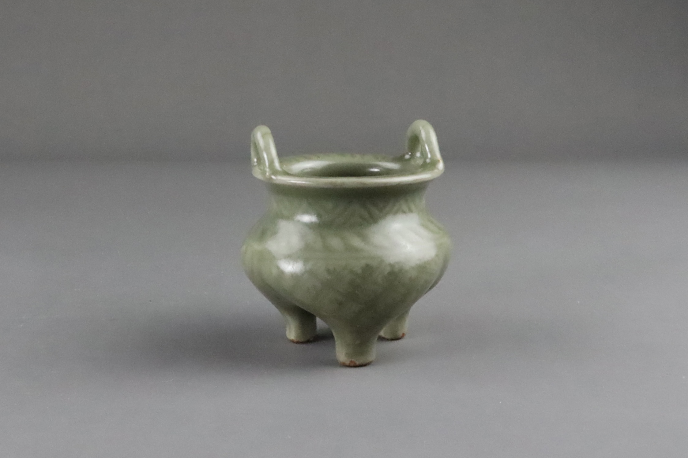 A Carved Longquan Celadon Tripod Incense Burner, early Ming dynasty - Image 9 of 11