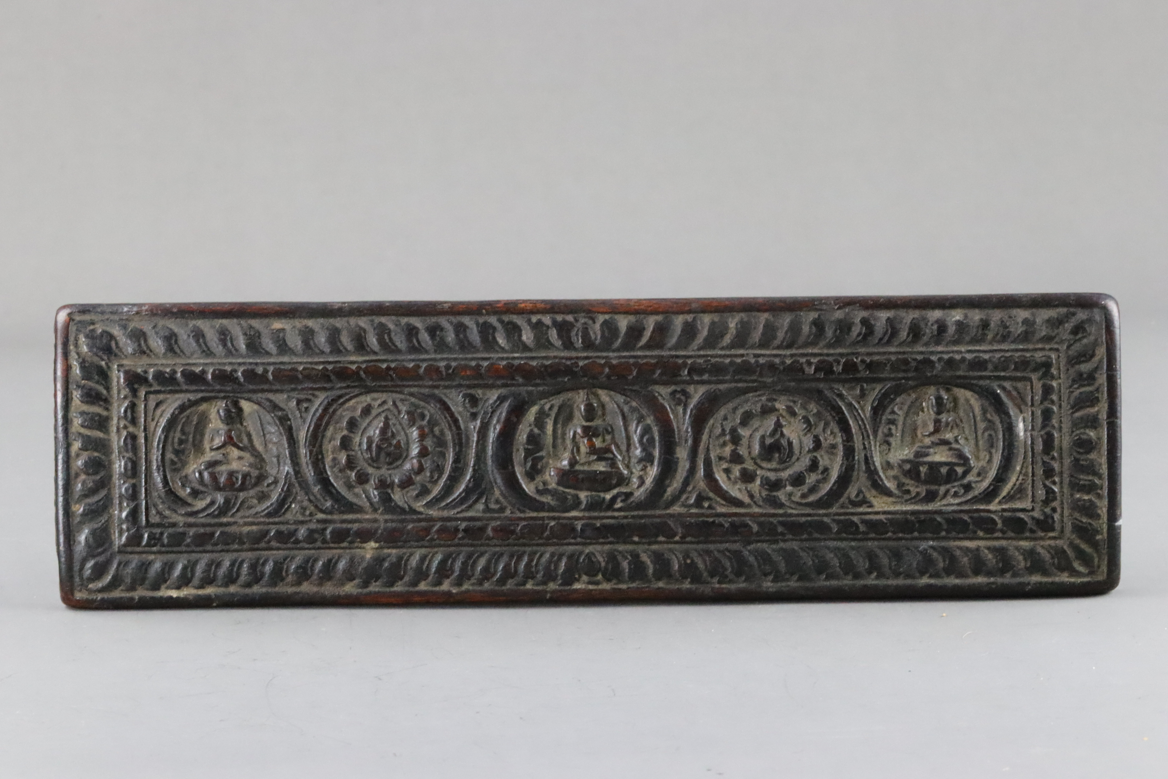 A Blackwood Book Cover carved with Buddhas, 15th century - Image 2 of 8