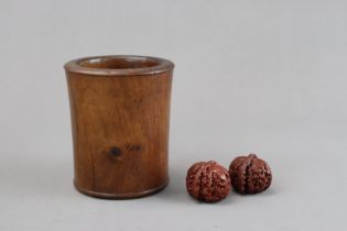 A Pair of carved Walnuts and a Wood Brushpot, 19/20th Century