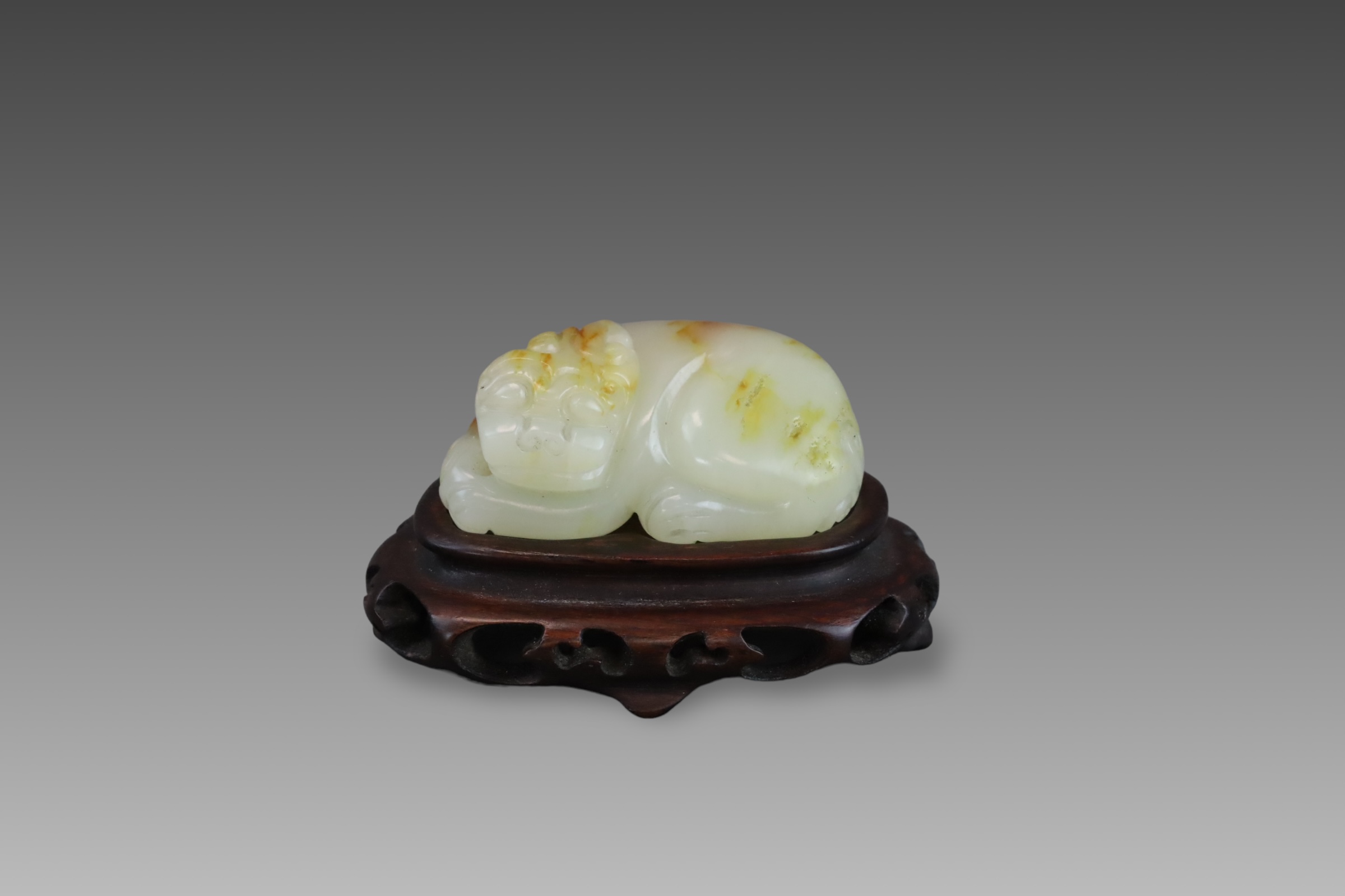 A Celadon Jade Seated Qilin, early Qing dynasty,