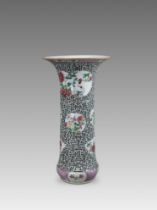 A Carved 'famille rose' Beaker Vase, Yongzheng,