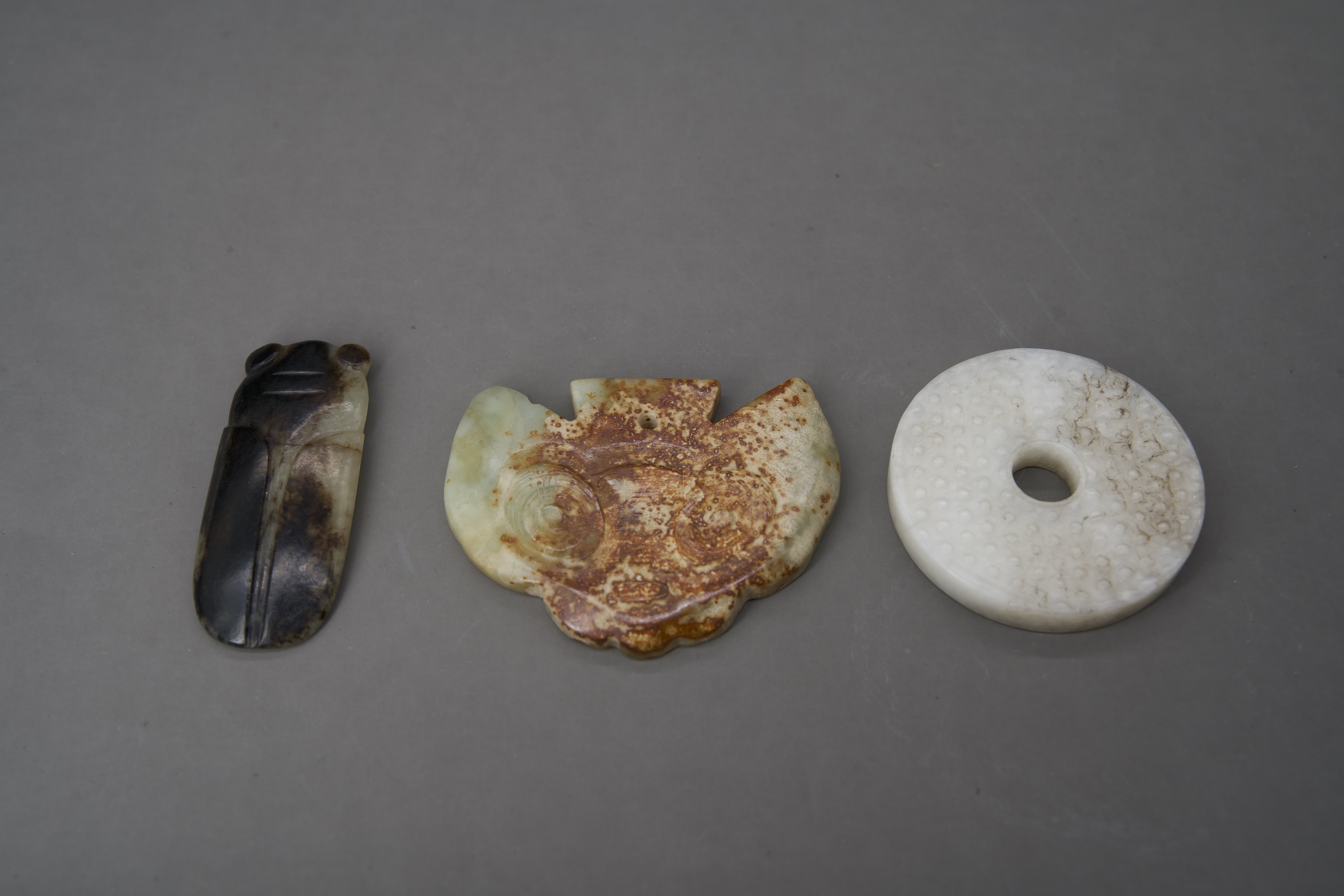 A Miniature Jade Bi Disc, 18th century, and two archaistic jades - Image 2 of 4