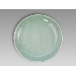 A Rare Celadon Large Dish carved with Lotus, six character underglaze blue mark of Kangxi