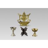 A Gilt Copper Altar Emblem, 17/18th century, Two Butter Lamps and a Stand, 19/20th century,