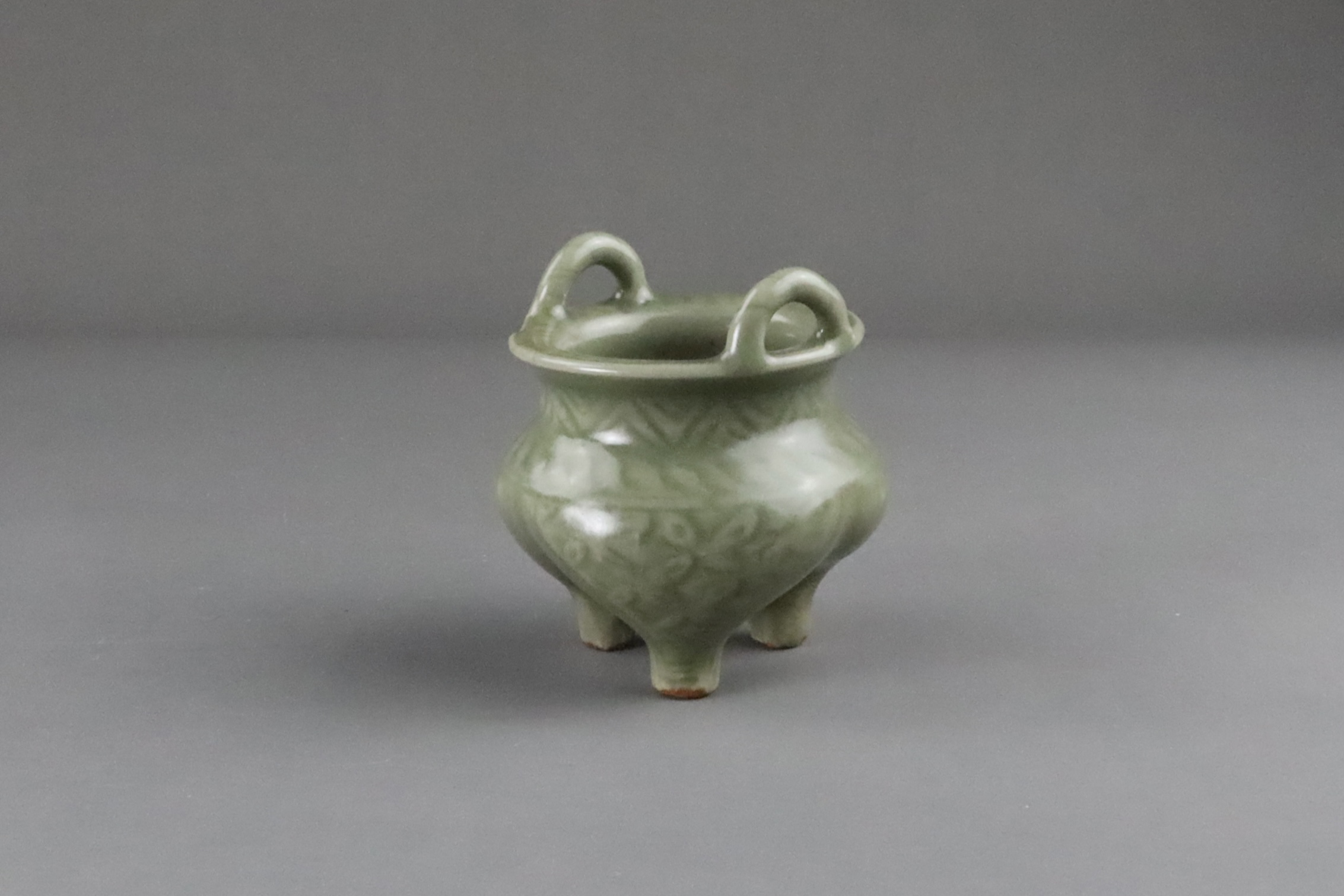 A Carved Longquan Celadon Tripod Incense Burner, early Ming dynasty - Image 7 of 11