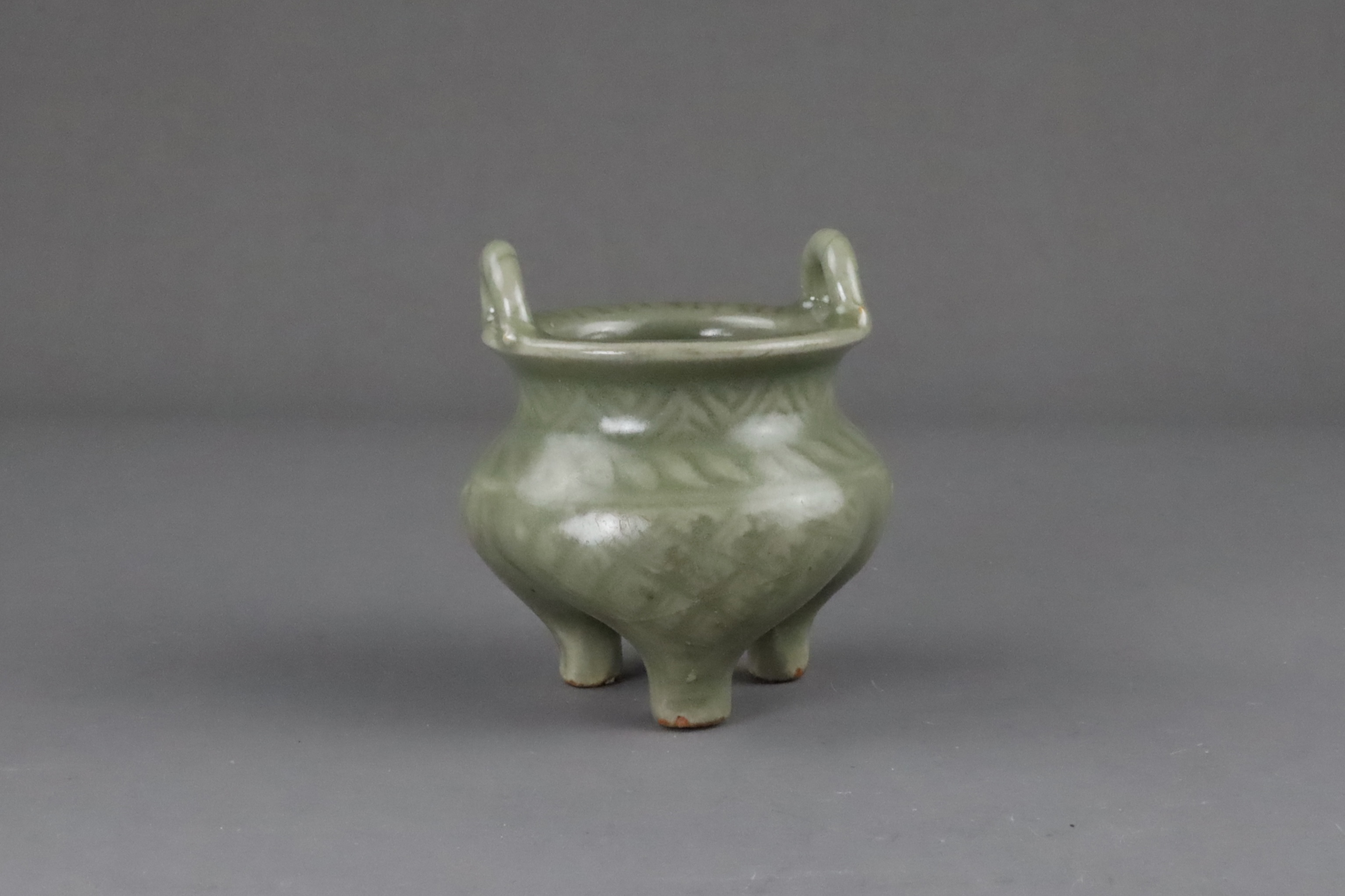 A Carved Longquan Celadon Tripod Incense Burner, early Ming dynasty - Image 2 of 11