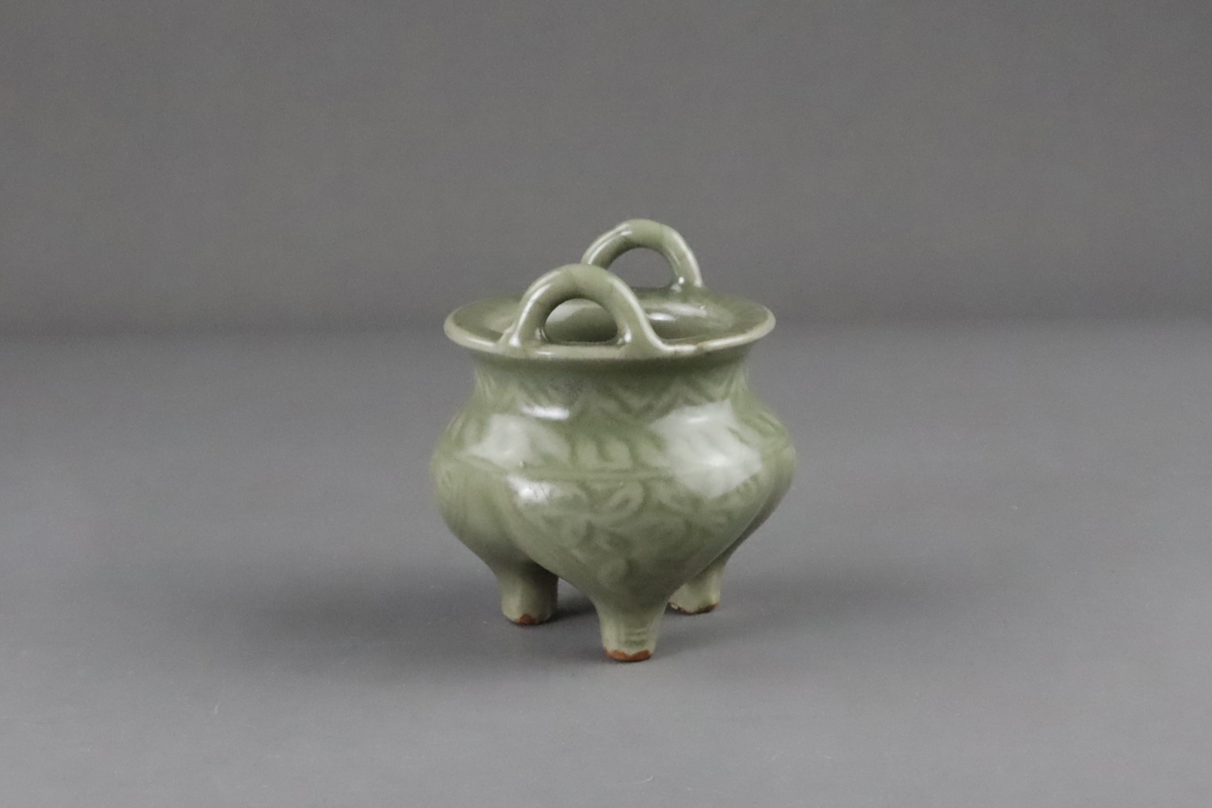 A Carved Longquan Celadon Tripod Incense Burner, early Ming dynasty - Image 5 of 11