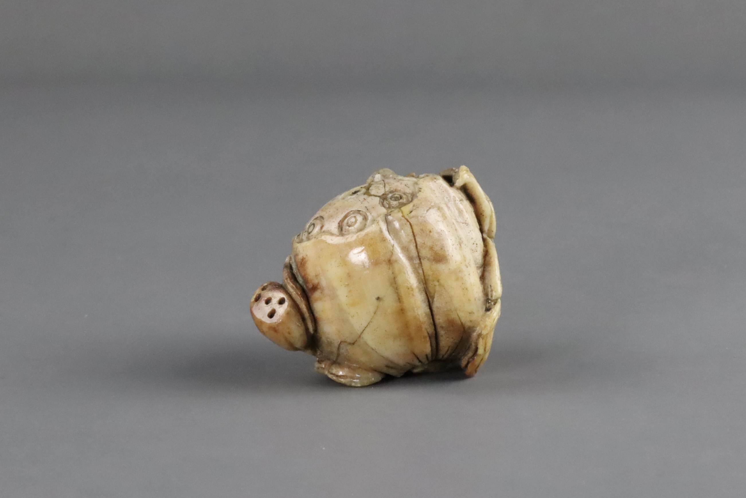 A Burnt Jade Lotus Pod Carving, Qing dynasty