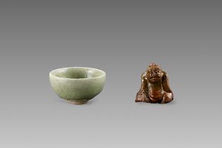 An Amber-glazed Figure and A Celadon Cup, Han dynasty and Sui dynasty