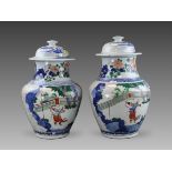 A Good Pair of Wucai Jars and Covers with Figures, 19th century,