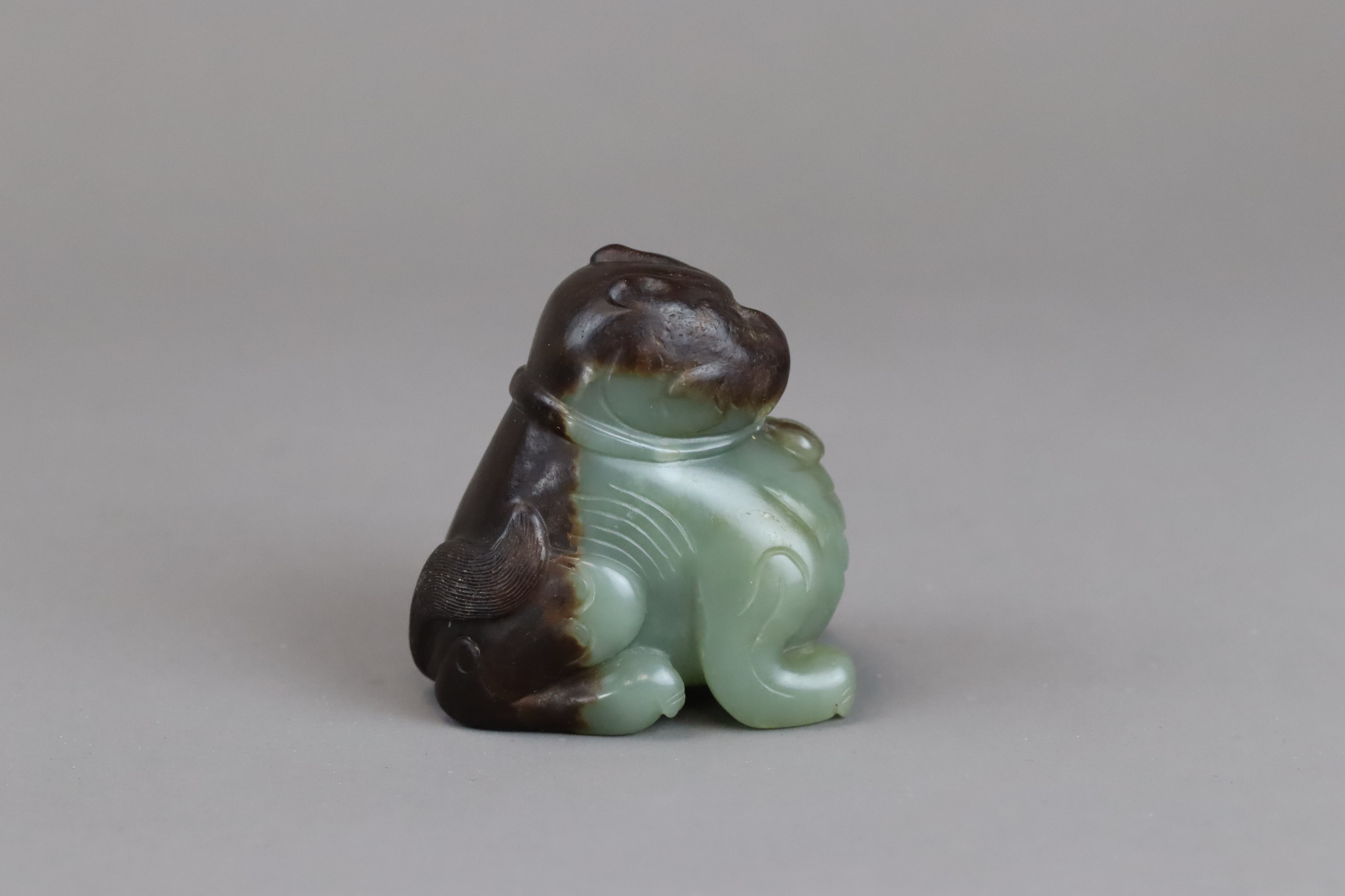 A Green and Brown Jade Seated Lion, Ming dynasty, - Image 2 of 10