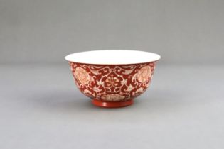 A Coral Ground Bowl with Scrolling Flowers, six character underglaze blue seal mark of Qianlong and 