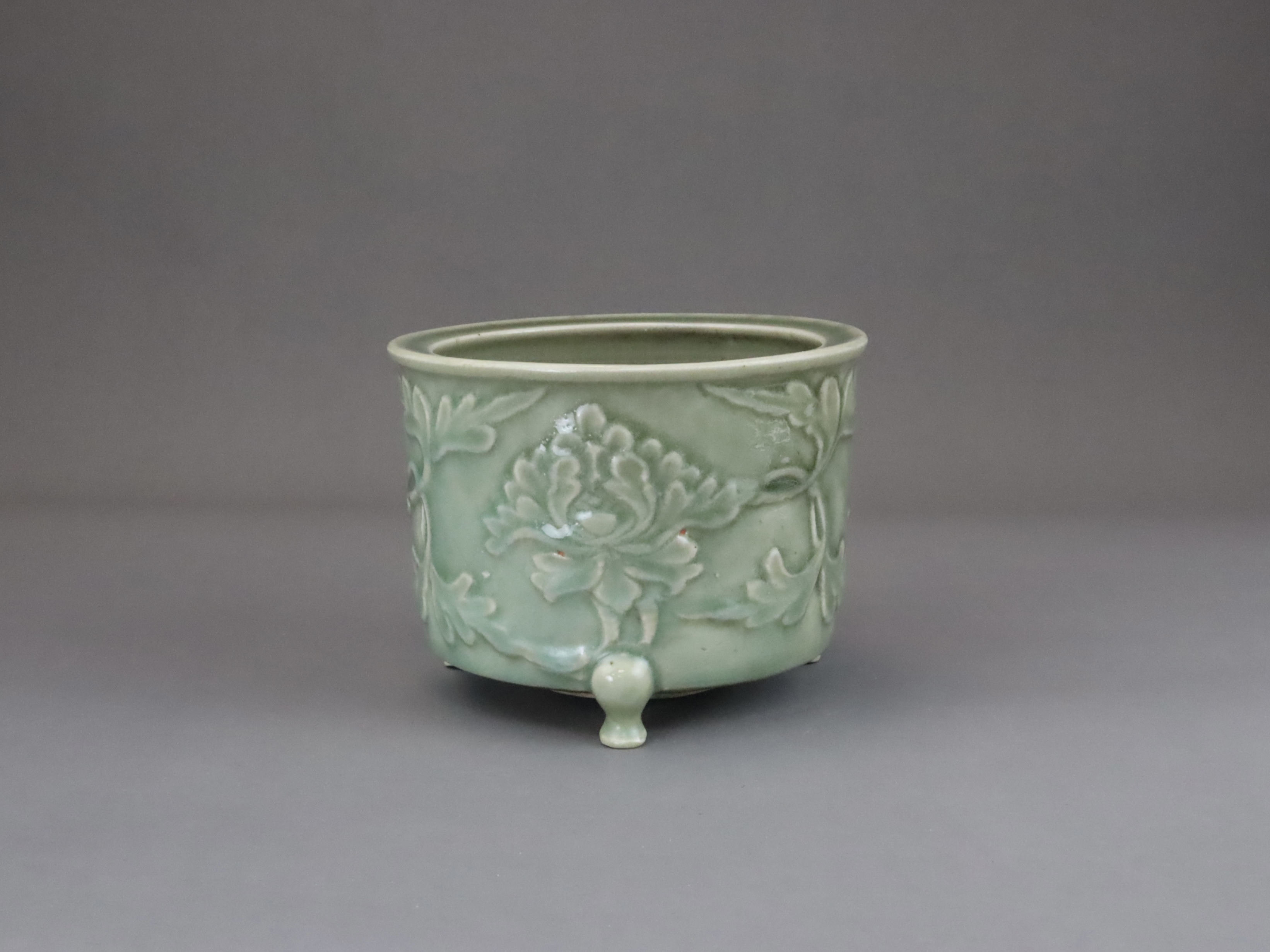 A Longquan Celadon Peony Tripod Censer, early Ming dynasty,  - Image 3 of 14