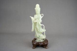 A Pale Celadon Jade Guanyin, 19/20th century,