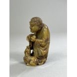 A Soapstone Lohan with a Fabulous Animal, 19th century