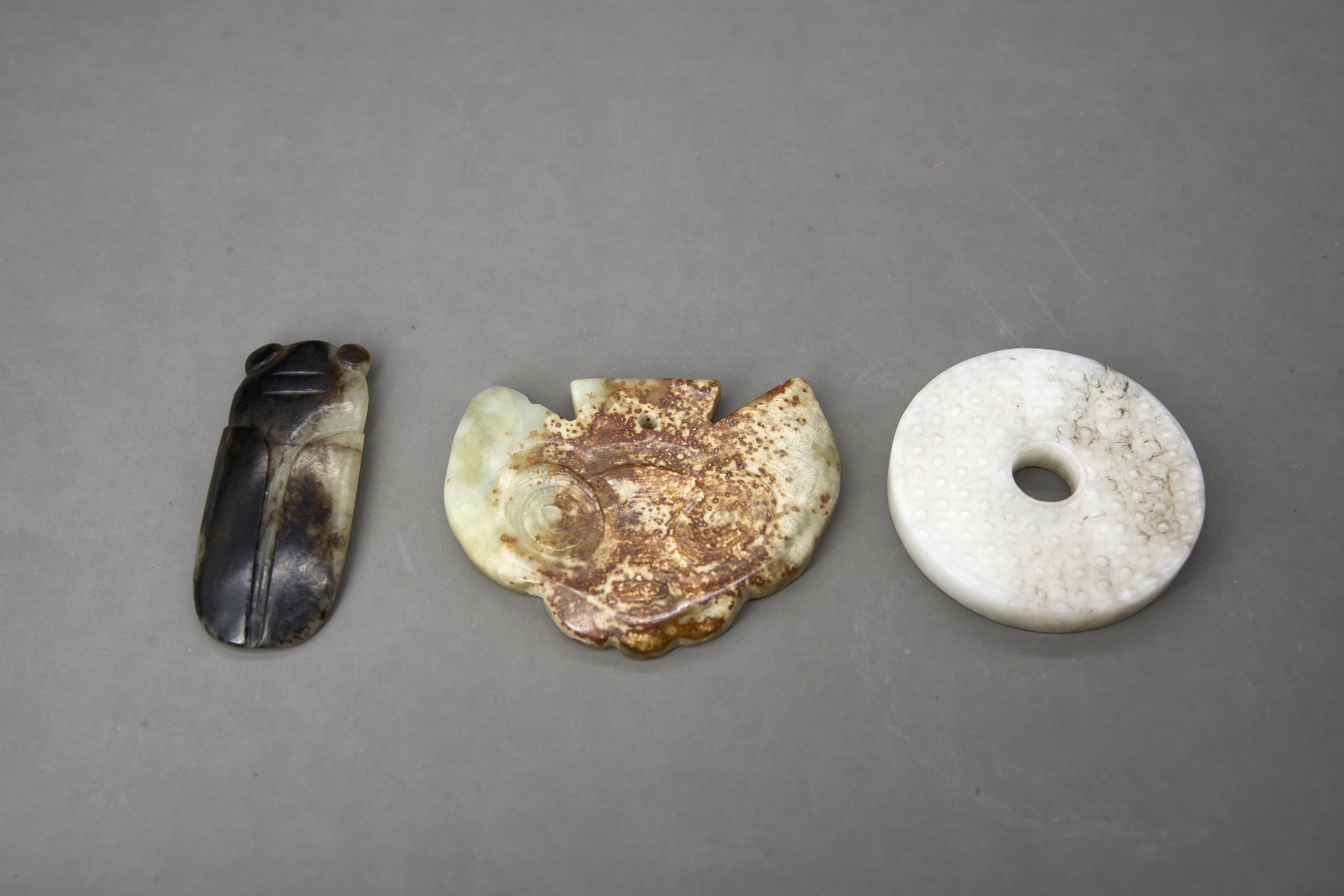 A Miniature Jade Bi Disc, 18th century, and two archaistic jades