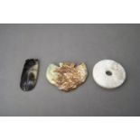 A Miniature Jade Bi Disc, 18th century, and two archaistic jades