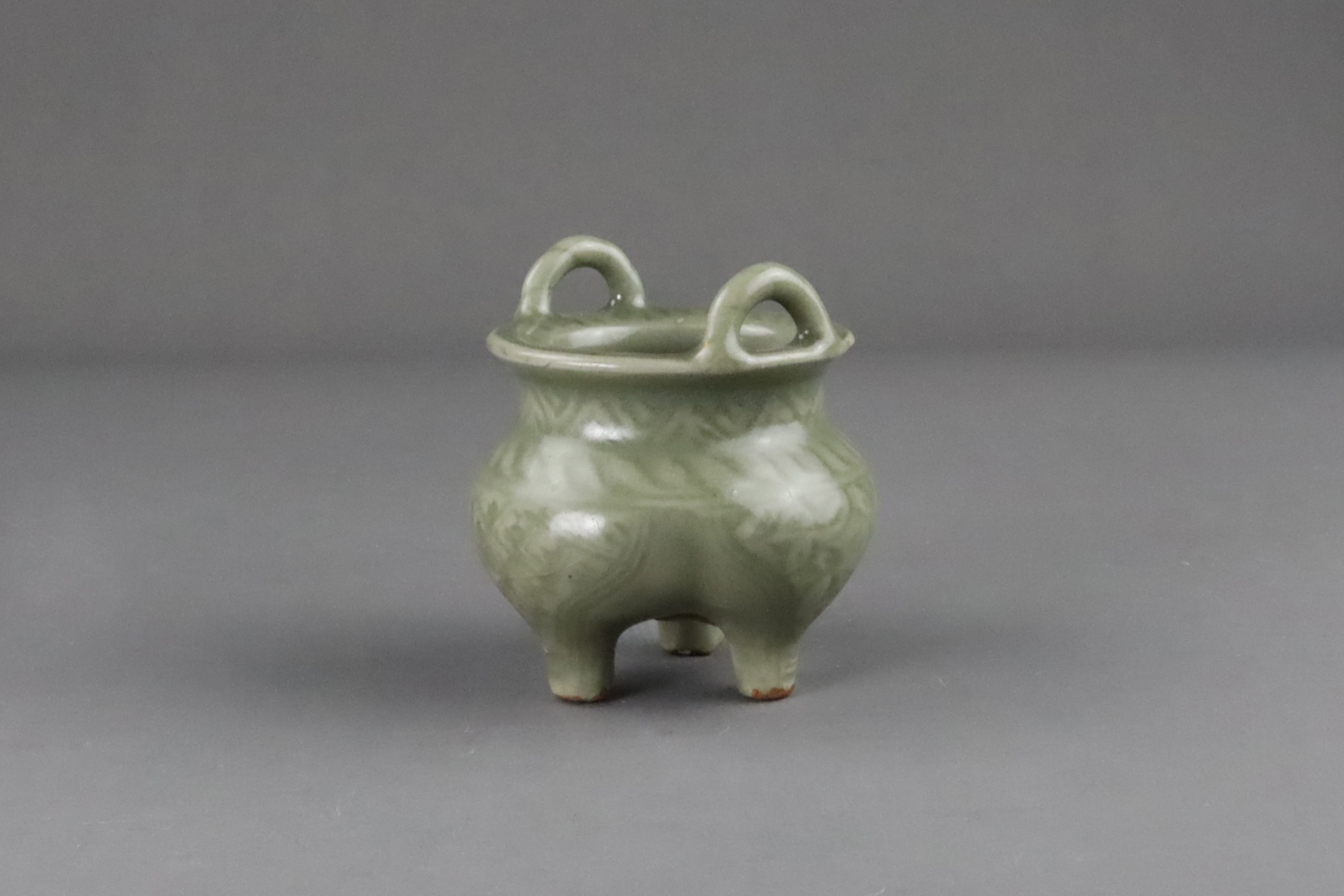 A Carved Longquan Celadon Tripod Incense Burner, early Ming dynasty - Image 4 of 11