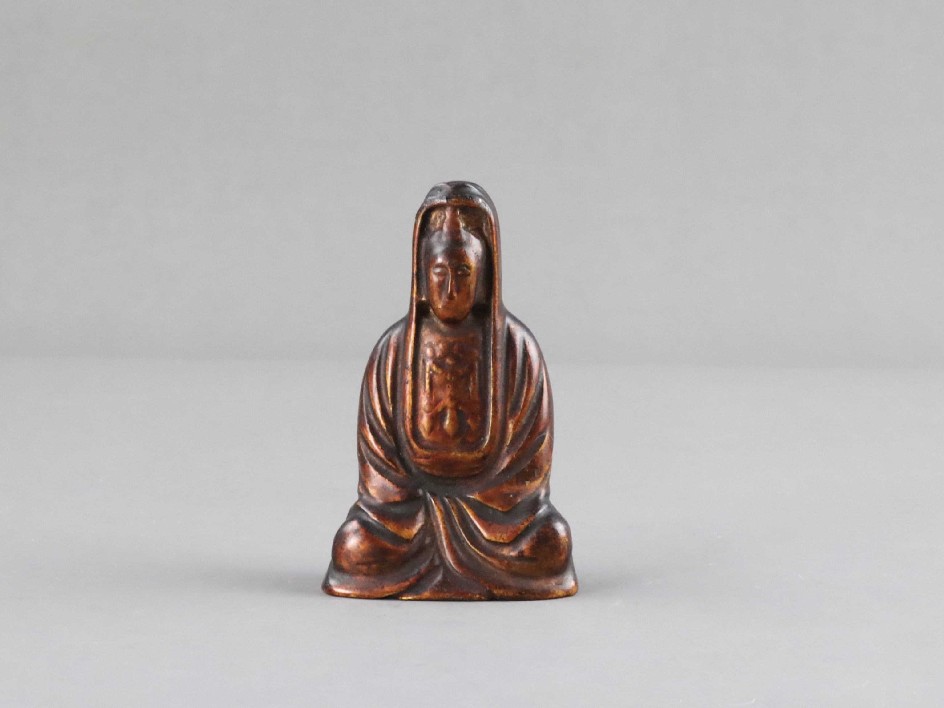 A Rare Lacquered Jade seated Guanyin, Ming dynasty or earlier,