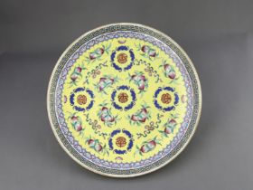A Yellow ground famille rose Dish, six character underglaze blue mark of Guangxu and of the per