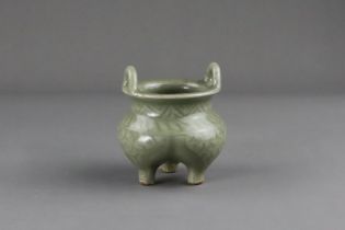 A Carved Longquan Celadon Tripod Incense Burner, early Ming dynasty