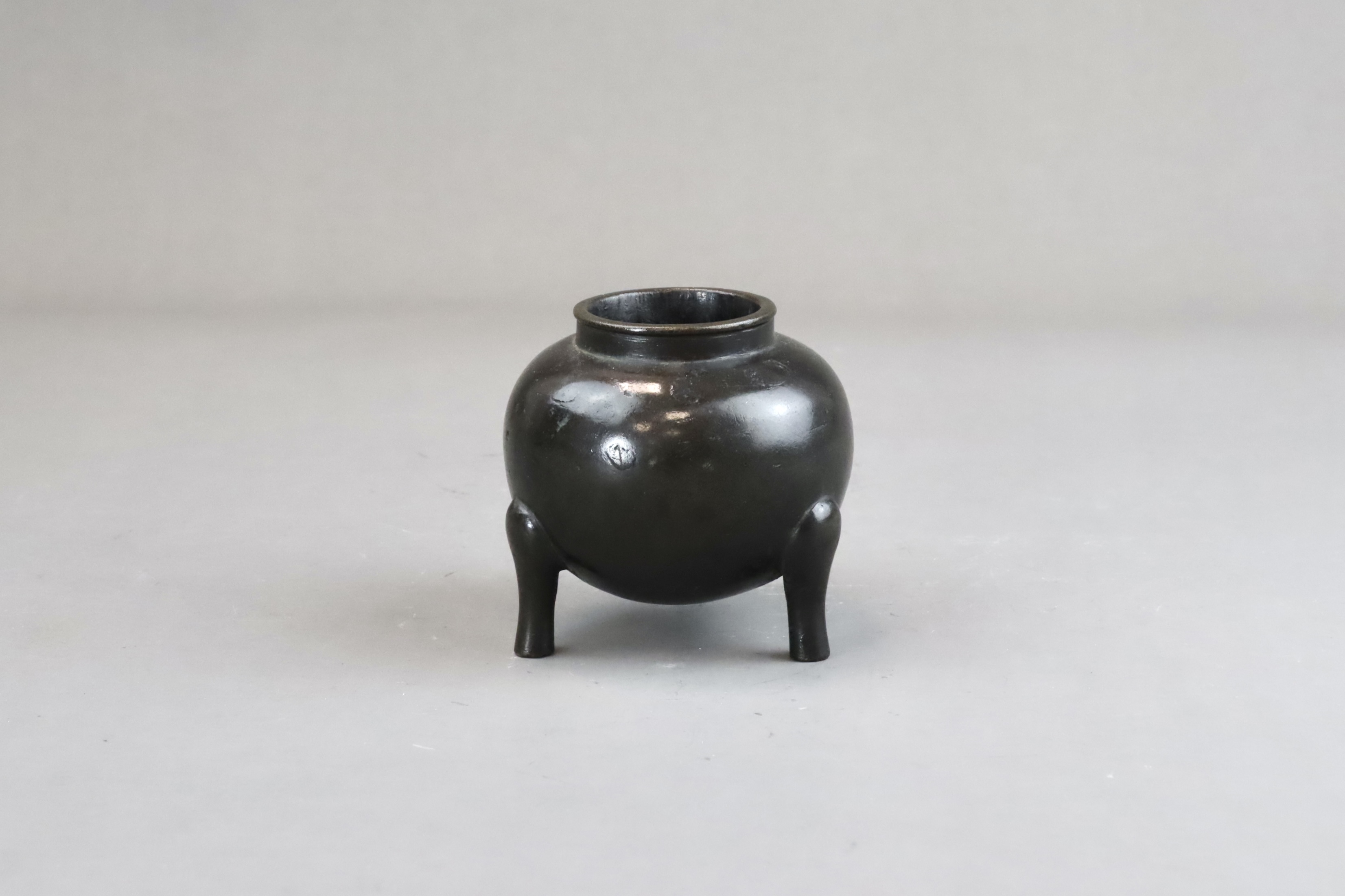 A Globular Bronze Tripod Waterpot, li ding, Ming dynasty