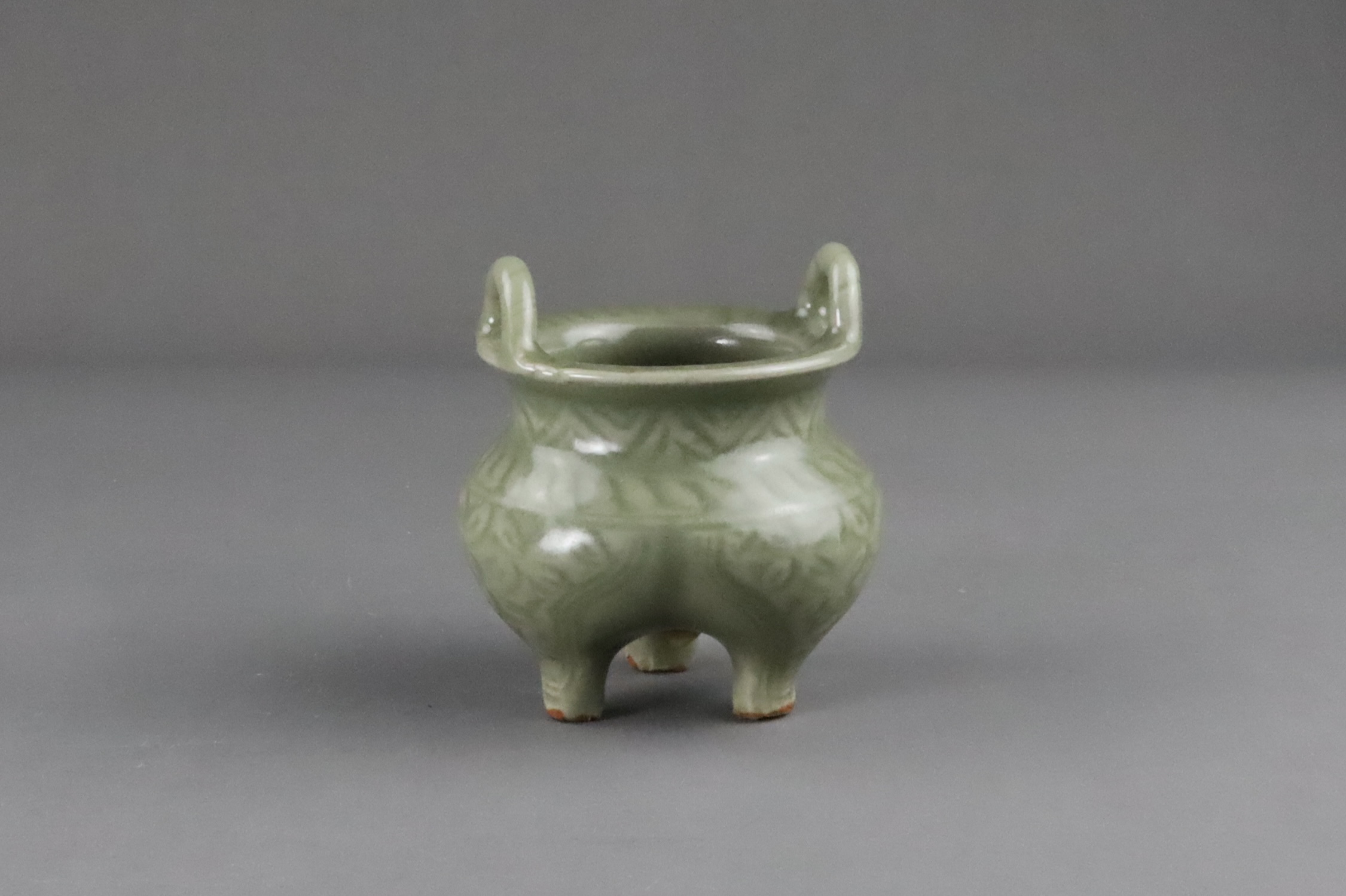 A Carved Longquan Celadon Tripod Incense Burner, early Ming dynasty - Image 6 of 11