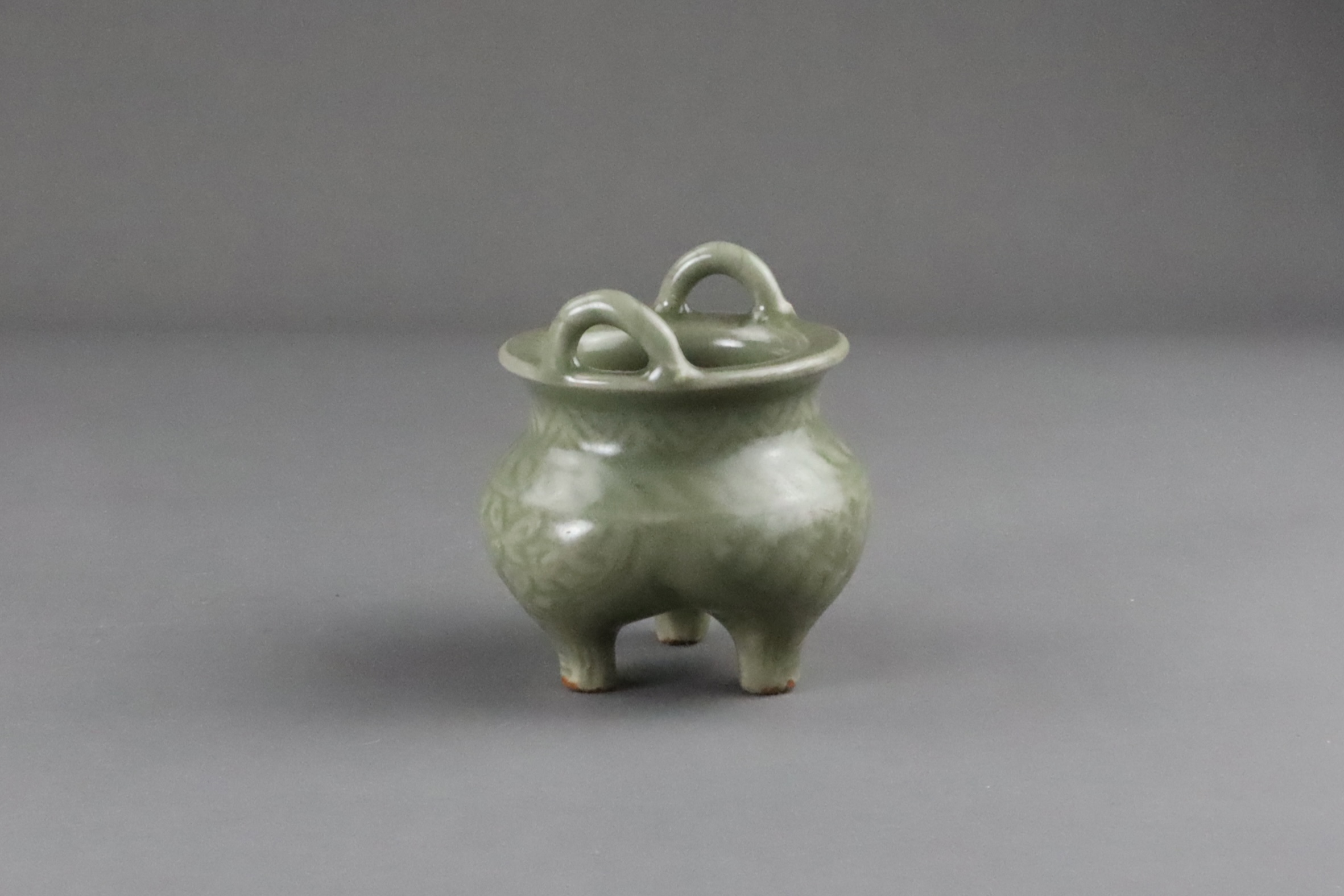 A Carved Longquan Celadon Tripod Incense Burner, early Ming dynasty - Image 8 of 11