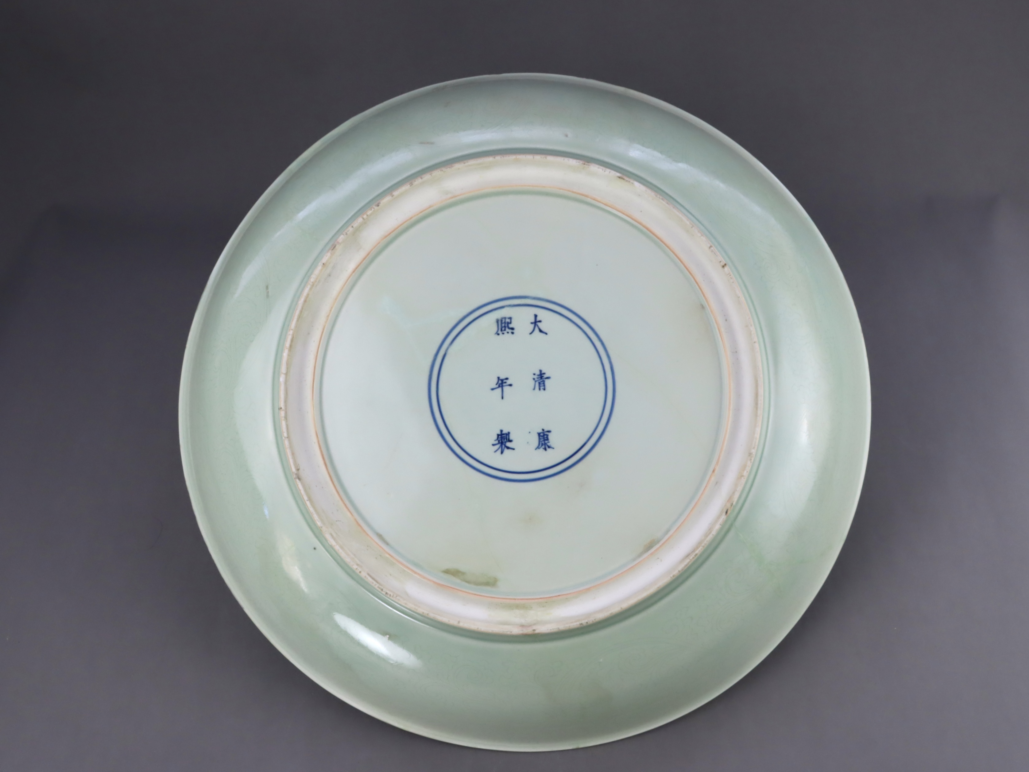 A Rare Celadon Large Dish carved with Lotus, six character underglaze blue mark of Kangxi - Image 4 of 8